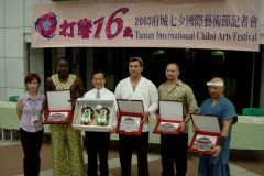 Randy in a gift exchange with the Mayor of Tainan city and group leaders from Ivory Coast, Uzbekistan, and Japan. Taiwan 2003